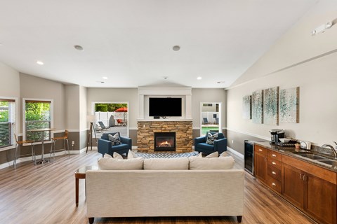 a living room with a couch and a fireplace